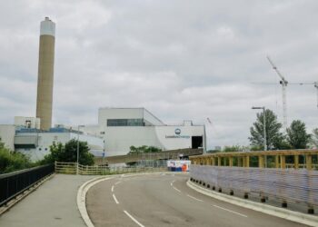 a road with a building in the background