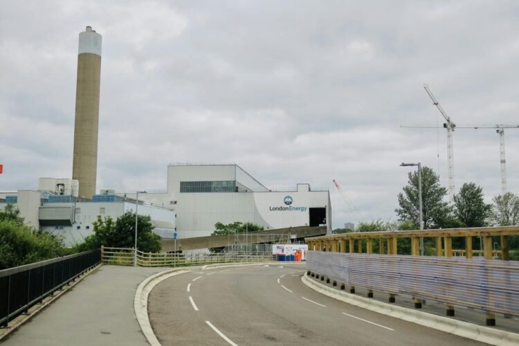 a road with a building in the background